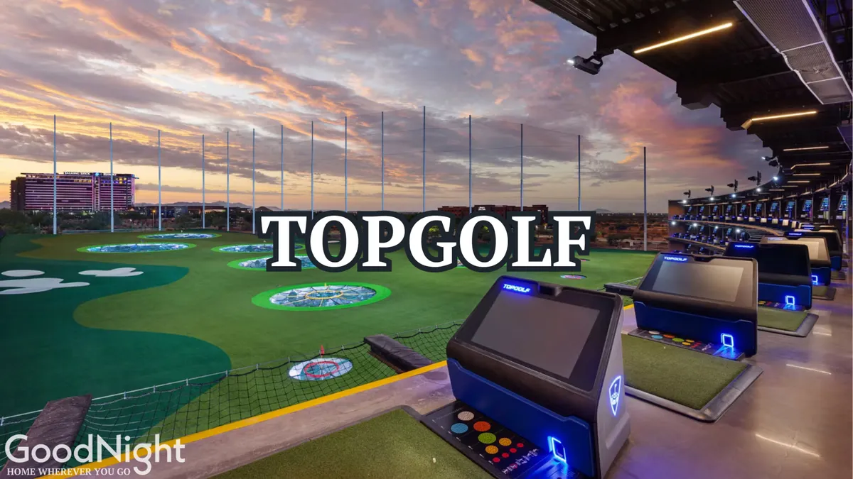 A dynamic view of Topgolf Scottsdale’s golfing stations, putting greens, and distant skyline, buzzing with energy and social activity as guests enjoy games and camaraderie.